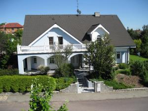 a white house with a roof at Homestay Kuchařovice in Kuchařovice