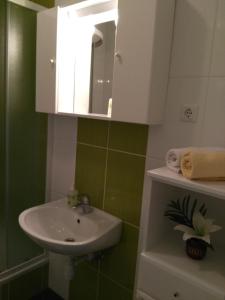 a bathroom with a sink and a mirror at Apartment Sveta Nedilja 13753e in Jelsa
