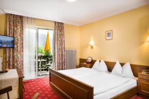 Posteľ alebo postele v izbe v ubytovaní Landhotel Steindlwirt + 35 fotografií