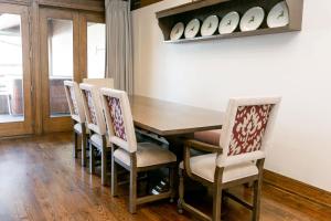 a dining room with a wooden table and chairs at Bald Eagle Two Bedroom apartment hotel in Park City