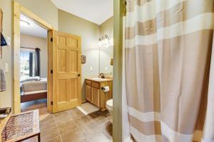 a bathroom with a toilet and a sink at Boulder Ridge Lodge in Lead +26 photos