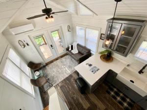 an overhead view of a living room and kitchen in a tiny house at Farmhouse Style Tiny Home with Patio - 4 mi to Town in Fredericksburg