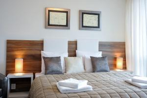 מיטה או מיטות בחדר ב-Apartamenty Starówka - Riverside