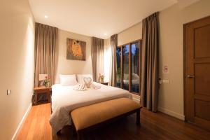 Katil atau katil-katil dalam bilik di Casada Suitte Pool Villa +11 gambar