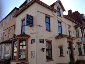 a building with a sign on the side of it at Glen Guest House in Blackpool