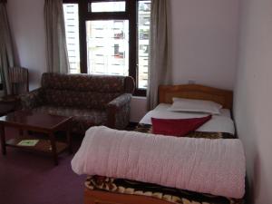 Postel nebo postele na pokoji v ubytování New Summit Guest House