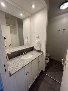a bathroom with a sink and a mirror at Mirador San Francisco in Salta