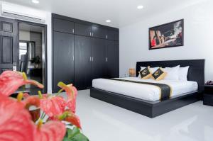 Postel nebo postele na pokoji v ubytování Hoang Long Hotel Phan Thiết