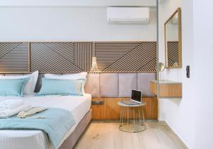 Elisavet Nuevo Studios & Suites客房内的一张或多张床位