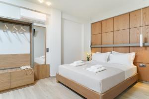 Elisavet Nuevo Studios & Suites客房内的一张或多张床位