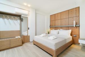 Elisavet Nuevo Studios & Suites客房内的一张或多张床位