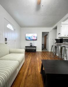 a living room with a couch and a table at Cozy Home in the Heart of Pocatello in Pocatello