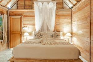 Postel nebo postele na pokoji v ubytování Nauna Villa Ubud