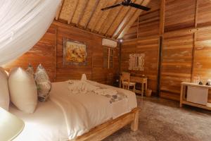 Postel nebo postele na pokoji v ubytování Nauna Villa Ubud