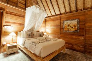Postel nebo postele na pokoji v ubytování Nauna Villa Ubud