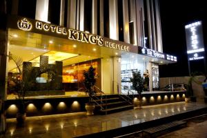 a hotel kings residence at night with lights at Hotel Kings Heritage Surat in Surat