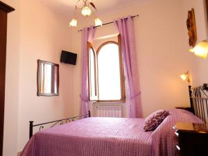 Postel nebo postele na pokoji v ubytování Villa dei Fantasmi