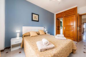 Łóżko lub łóżka w pokoju w obiekcie Apartamento Socorro 39-1
