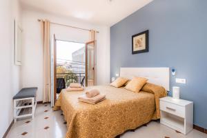Łóżko lub łóżka w pokoju w obiekcie Apartamento Socorro 39-1