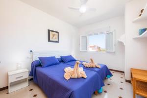 Łóżko lub łóżka w pokoju w obiekcie Apartamento Socorro 39-1
