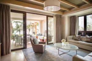 a living room with a couch and a table at Jumeirah Al Naseem Dubai in Dubai