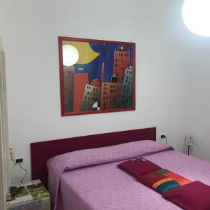 A bed or beds in a room at Casa Tognetti Affittacamere