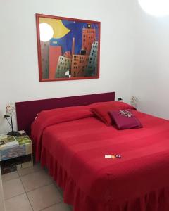 A bed or beds in a room at Casa Tognetti Affittacamere
