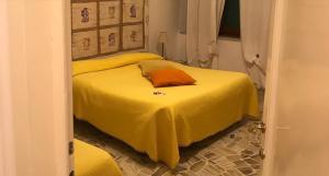 A bed or beds in a room at Casa Tognetti Affittacamere