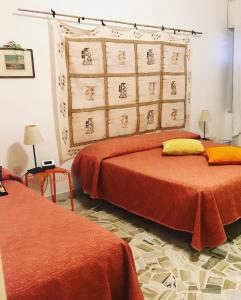 A bed or beds in a room at Casa Tognetti Affittacamere