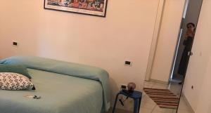 A bed or beds in a room at Casa Tognetti Affittacamere