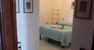 A bed or beds in a room at Casa Tognetti Affittacamere