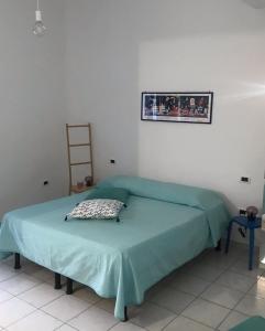 A bed or beds in a room at Casa Tognetti Affittacamere