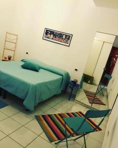 A bed or beds in a room at Casa Tognetti Affittacamere