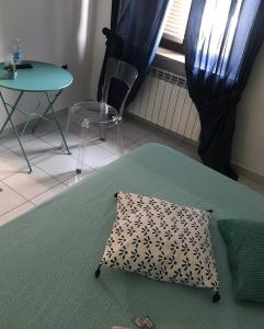 A bed or beds in a room at Casa Tognetti Affittacamere