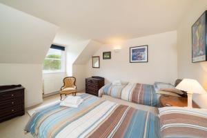 Llit o llits en una habitació de Earnside Cottage