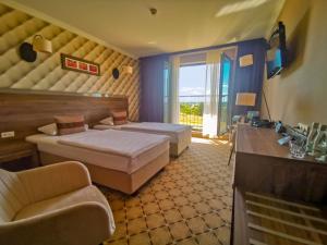 Posteľ alebo postele v izbe v ubytovaní Hotel Mistral Sport