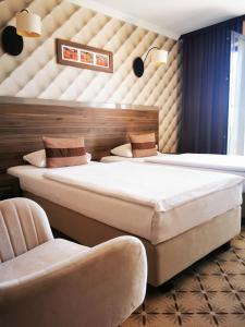 Posteľ alebo postele v izbe v ubytovaní Hotel Mistral Sport