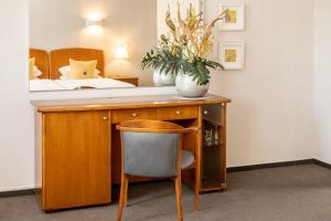 Postel nebo postele na pokoji v ubytování Hotel Moritz an der Elbe