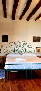 Łóżko lub łóżka w pokoju w obiekcie Villa Chiara