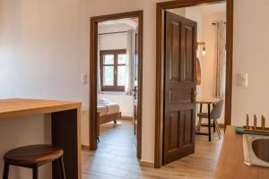 A bed or beds in a room at Μελίτη Pelion Luxury Living