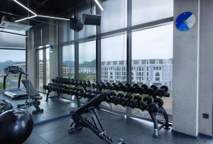 a gym with a view of a city at SOJO Hotel Lang Son in Lạng Sơn