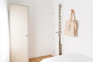 Posteľ alebo postele v izbe v ubytovaní WOW Apartments by Olala Homes