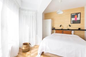 Posteľ alebo postele v izbe v ubytovaní WOW Apartments by Olala Homes