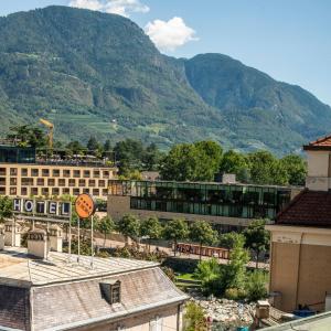 a view of a city with mountains in the background at Theatre Lodge Attico teatro in Merano