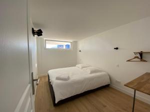 Posteľ alebo postele v izbe v ubytovaní Le BeachHaus - Appartement avec Jardin a 100m de la Mer