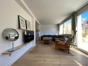 Posedenie v ubytovaní Le BeachHaus - Appartement avec Jardin a 100m de la Mer