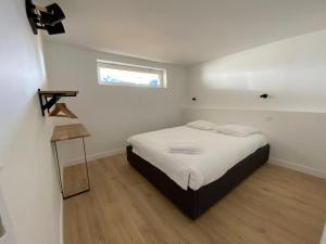 Posteľ alebo postele v izbe v ubytovaní Le BeachHaus - Appartement avec Jardin a 100m de la Mer