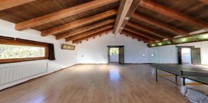 a large room with a ping pong table in it at Los Ahijaderos de Tus in Yeste