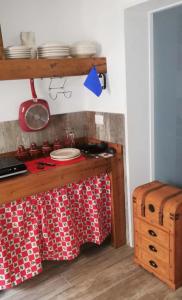 a kitchen with a counter with plates on it at CASA DI 'NZUSU in Carovigno