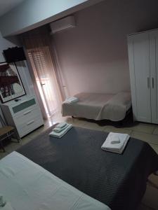 Postel nebo postele na pokoji v ubytování B&B Emmanuel